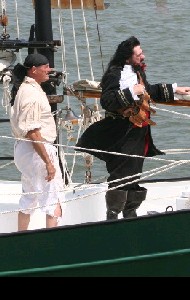 Blackbeard on his ship talking to Maynard