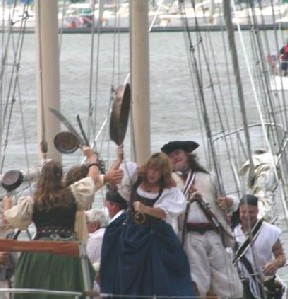 The wives of the Blackbeard crew fighting with pans