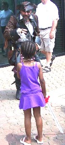 A little girl looking wearily at Spike