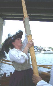 Mary holding up an oar