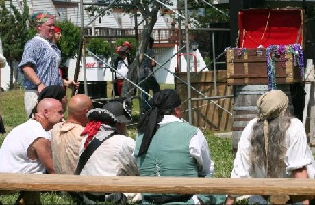 Pirates sitting around looking at the stage