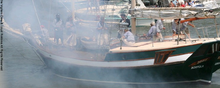 Ship firing it's cannon at the pirates