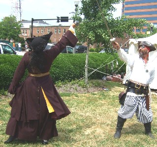 Mary Diamond and Captain Spike practice sword fighting