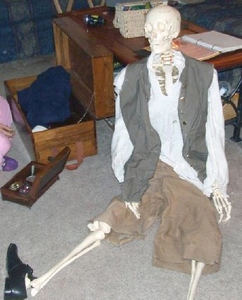 Bucky the skeleton in period clothes on the floor