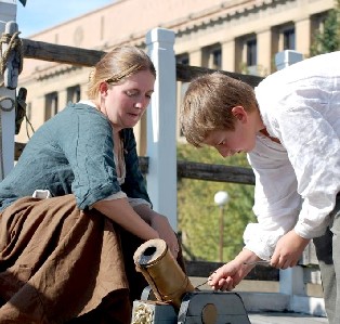 Kate Bagley and Miles fire the mortar