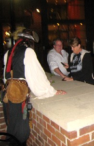 Count d'Booty soliciting people over the R-Bar patio wall