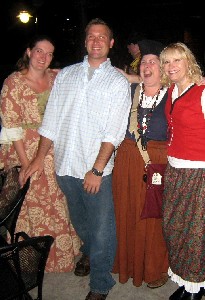 Guy posing with pirate girls