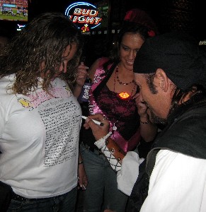 Shannon signing a bachelorette girl's shirt