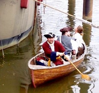 The scow moves away from the Santa Maria