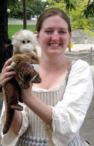 Kate holding Lob holding a tied up Ferret