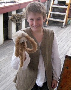 Miles holding Lob, who is covering his eyes