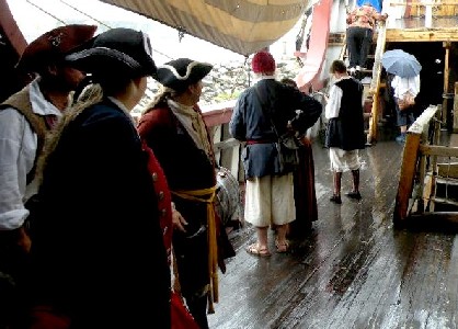 Crew hiding on the deck from the rain