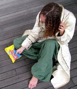 Rosabella doing her hair looking at Swedish Fish 1