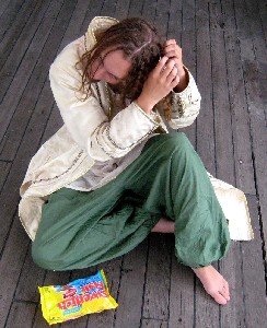 Rosabella doing her hair looking at Swedish Fish 2