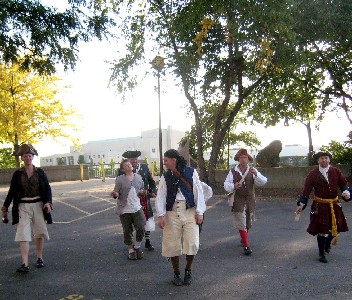 Pirates going through a parking lot on the way to the bar