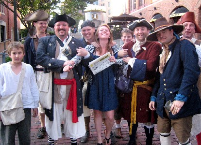 Pirates posing with a girl in a blue dress