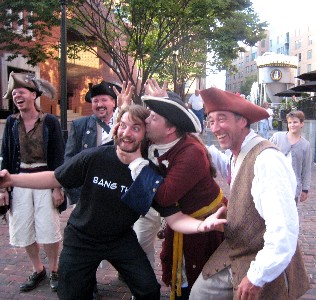 Pirates posing with a waiter or something