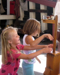 girls playing with bilge pump