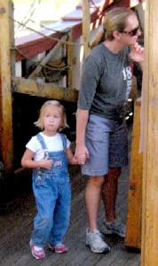 Little girl in bib overalls