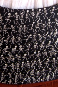 A corset with skeletons on it