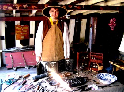 Mission holding a lightsaber. Sort of.