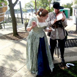 Shay taking notes while talking to Blue Jess