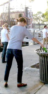 Scavenger hunters breaking a bottle