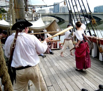 Thomas and Rachel fighting on the quarter deck