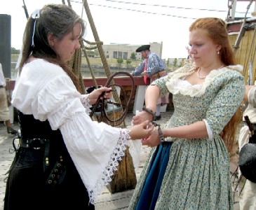 Trish shackling Blue Jess