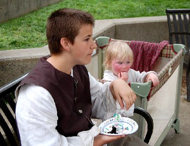 Andrew Thatcher and Hamish eating cake