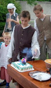 Andrew watching the cannon on his birthday cake