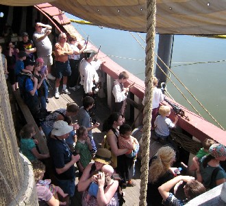 The crowd watching the battle from the main deck