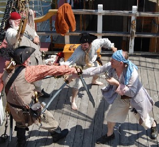 Pirates and defenders sword fight
