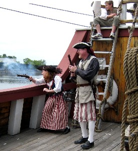 Chris and Lynn Gregg fire at the pirates from the Quarter Deck