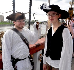 George attacking Sarah with his hook