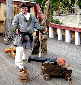 George looking dramatic with a pistol