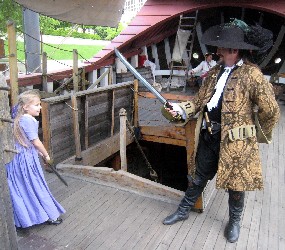 Shannon and Lilli sword-fighting