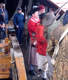 The crowd watches the gun firing
