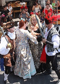 Dennis and Red Feather Threatening the Governor's Daughter 1