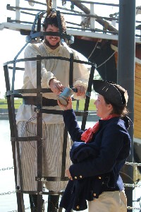 Andrea taking Daniel's mug