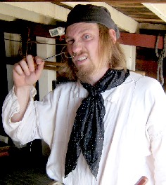 Thomas piercing his nose with retractor