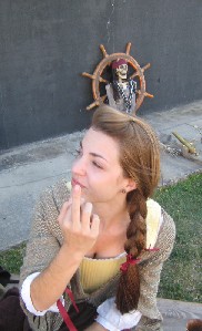 Mae showing finger bitten by iguana