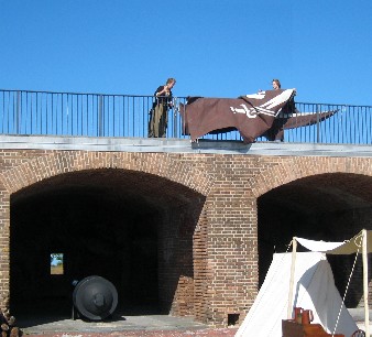 Twins straightening the Pyracy 
     Pub sign 1