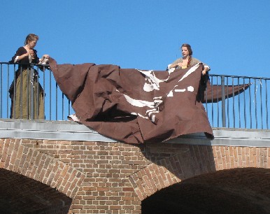 Twins straightening the Pyracy Pub sign 2