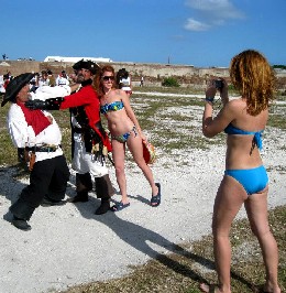 Bikini girls posing with pirates