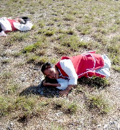 Sansanee laughing while playing dead