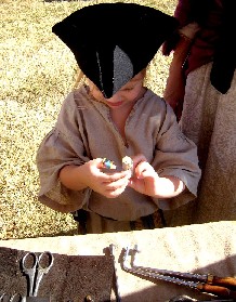 Kiera Examining a Bottle of Medicine