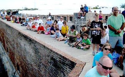 Crowd Sitting on Fort Wall