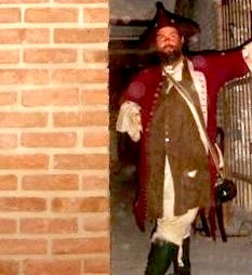 M.A. d'Dogge Standing by a Wall