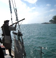 Profile of Stynky Firing His Gun